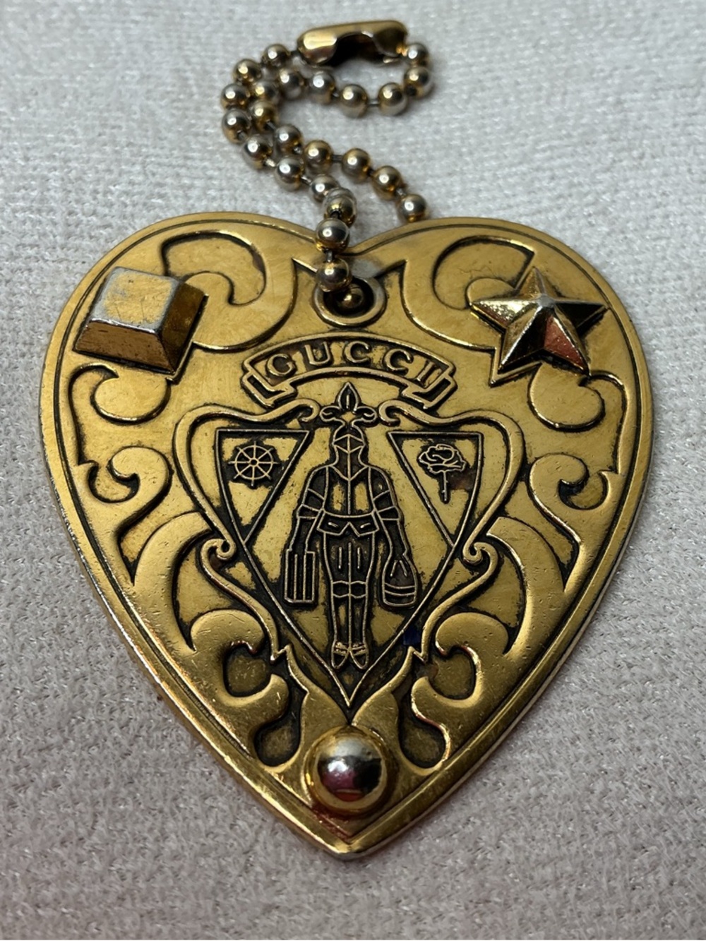 Gucci Gold Tone Embossed Heart Pendant Keyring
